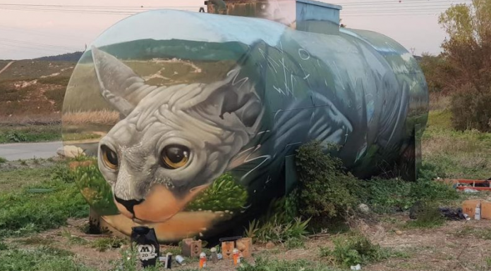 Artista urbano transforma tanque de gasolina em ilusão de ótica com um gato à espreita